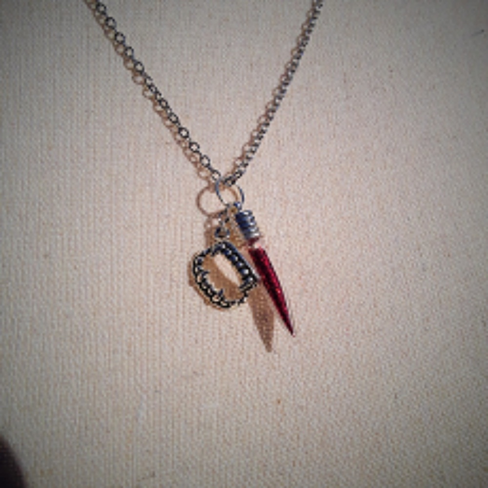 NWT, VAMPIRE TOOTH CHARMS.